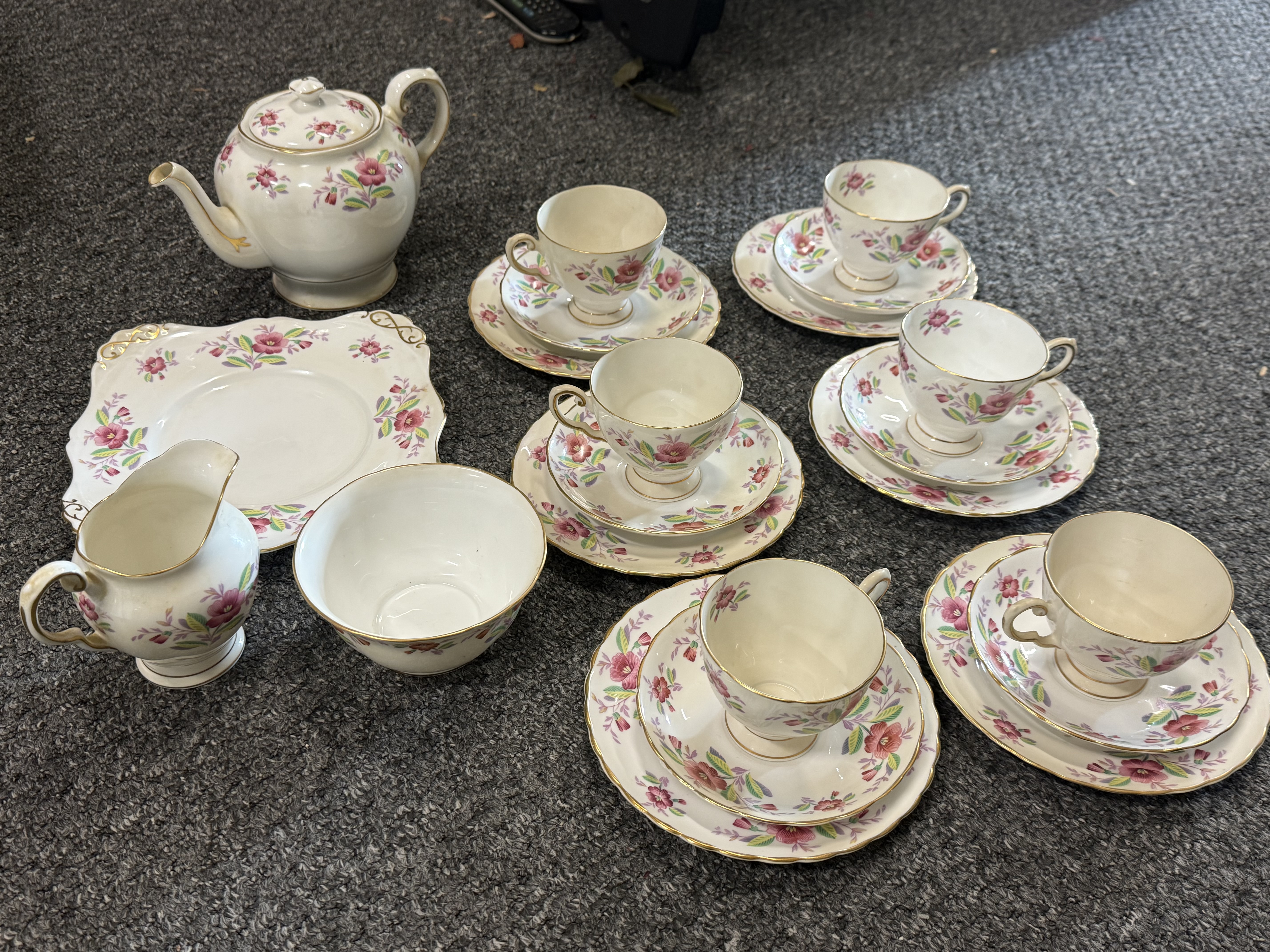 A Twenty-One Piece Tuscan Bone China Tea Service for Six
