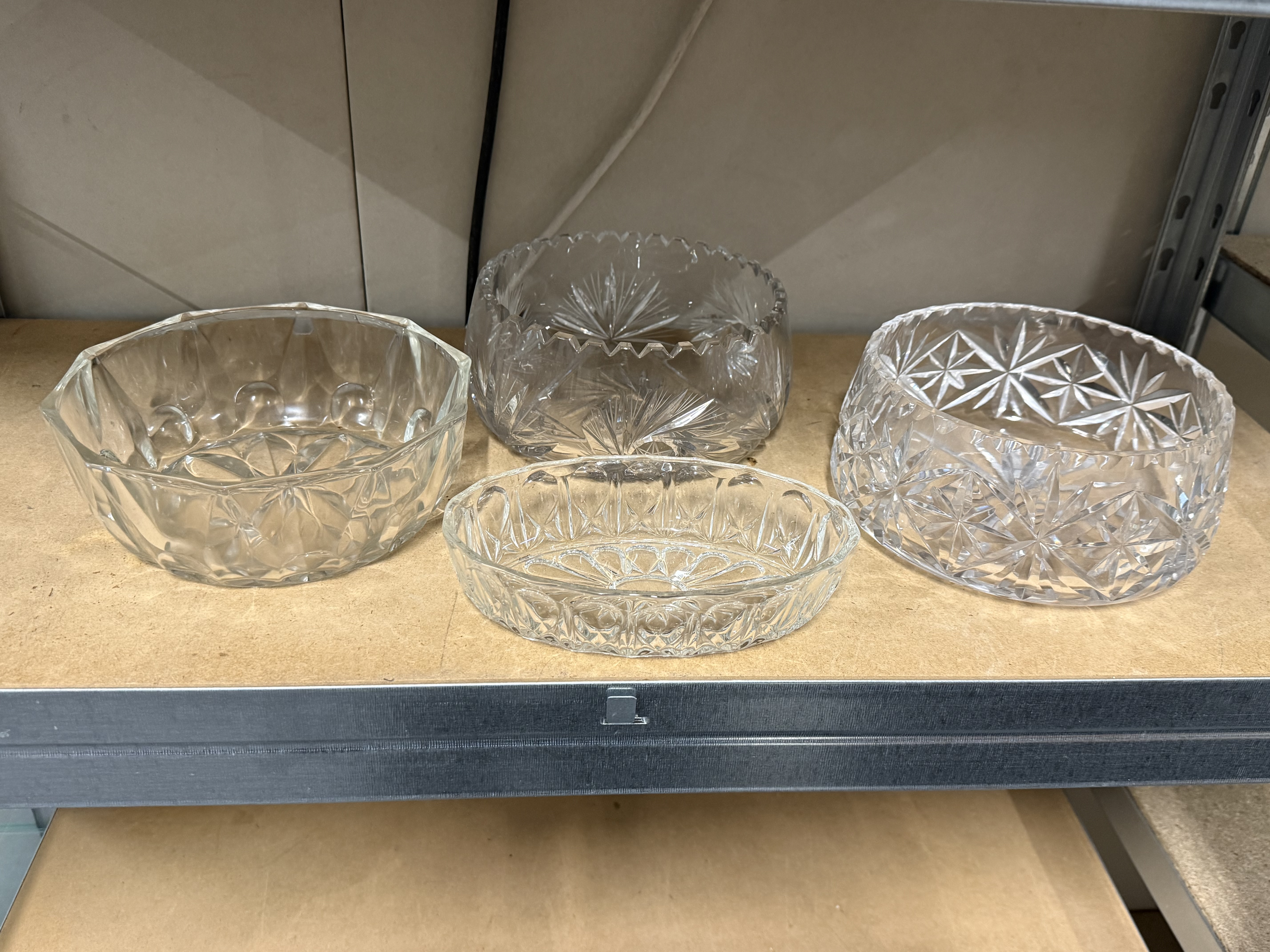 A collection of decorative cut glass and crystal bowls