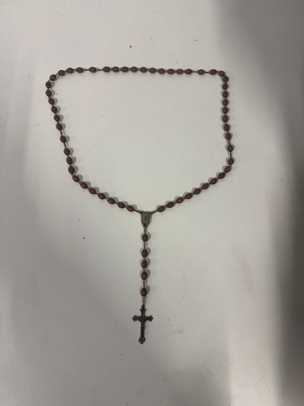 Lot 157: A Catholic rosary with turned wooden beads and metal crucifix