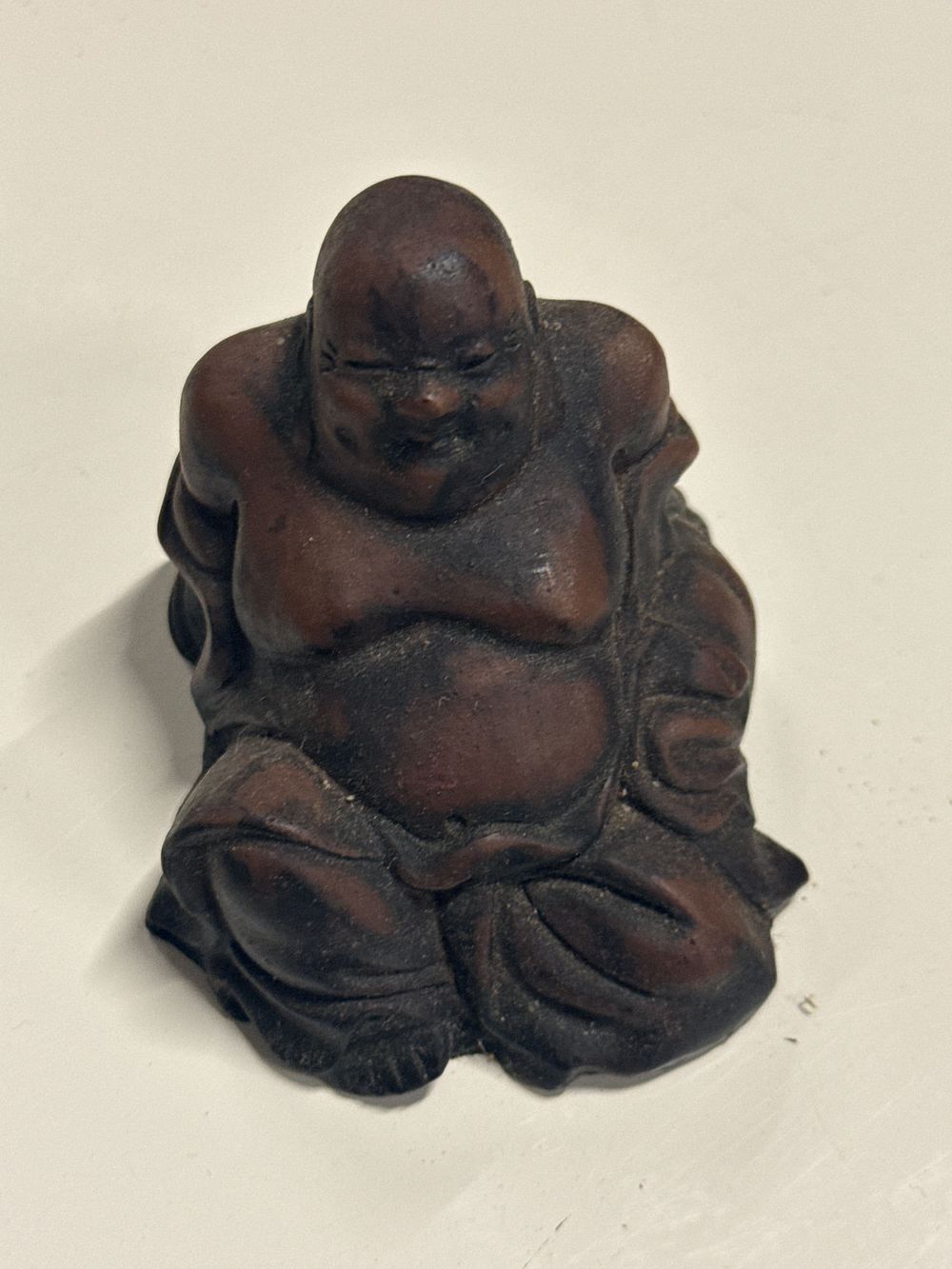 Lot 163: A figure of a reclining Budai