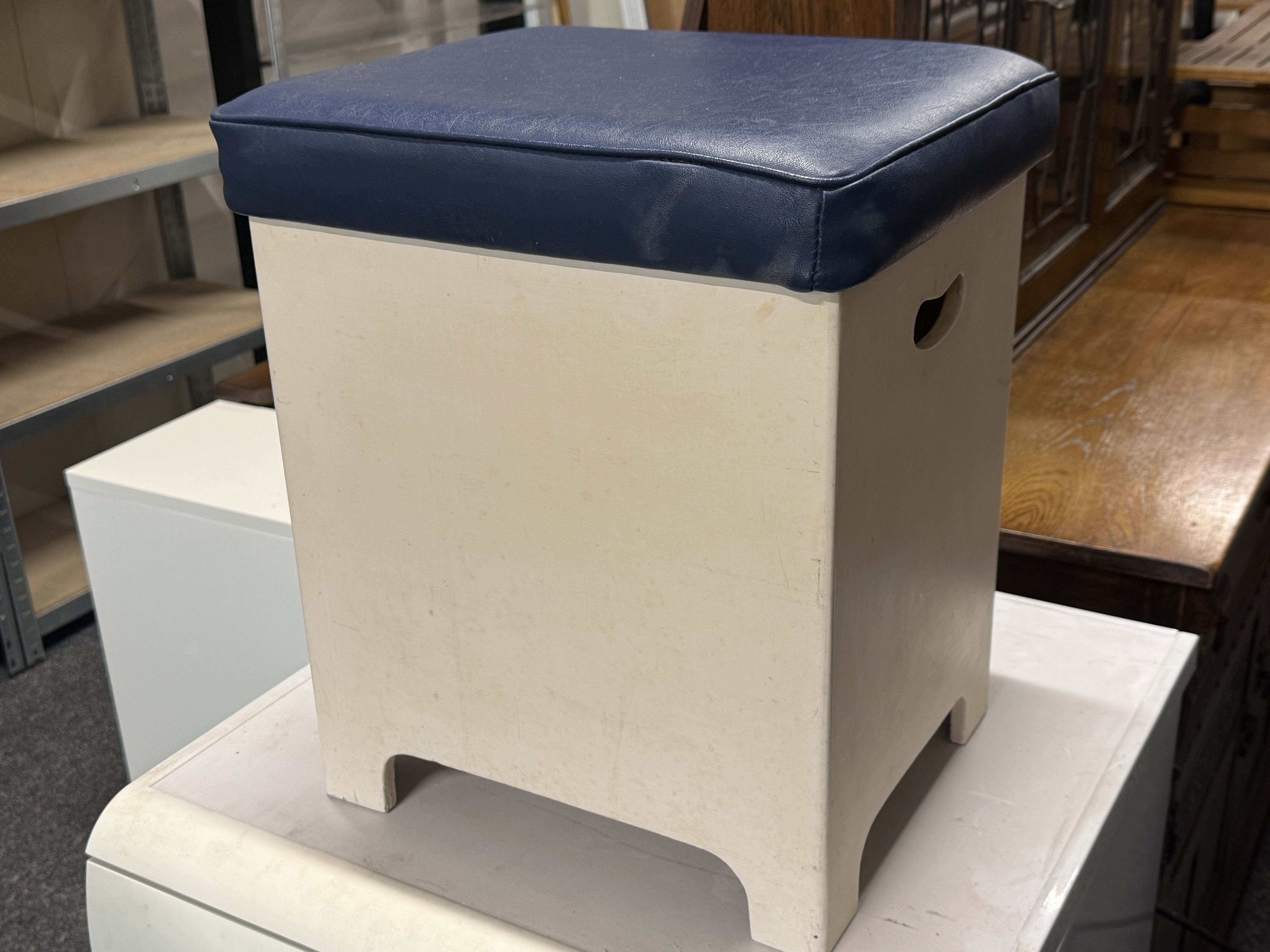 Mid-20th-century white painted storage stool with blue vinyl seat