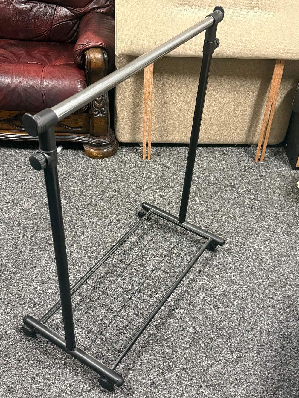 Lot 173: A contemporary black and silver adjustable rolling garment rack