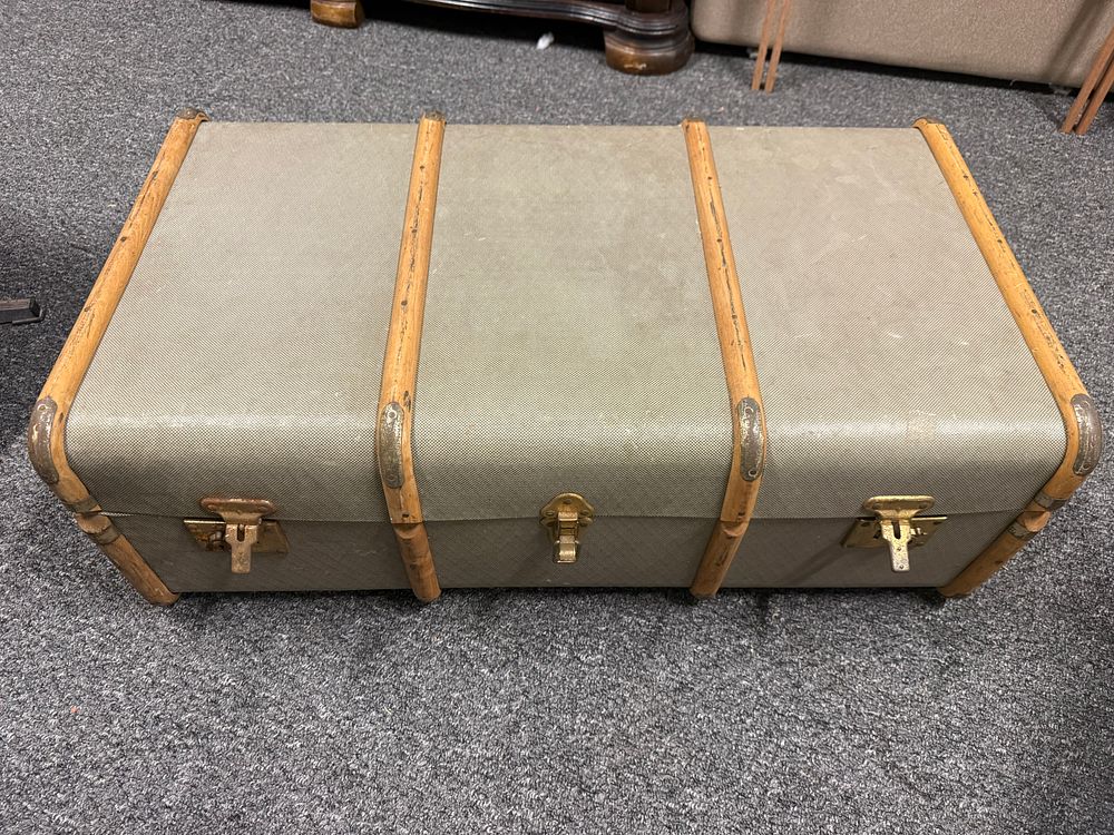 Lot 174: Mid-century wooden-slatted travel trunk with textured fabric look finish