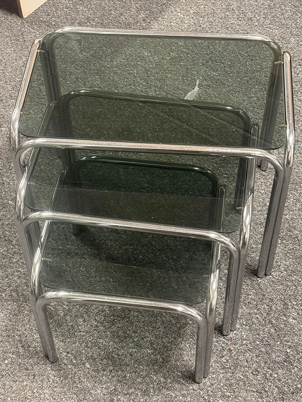 Lot 191: Trio of modernist 1970s chrome and smoked glass nesting tables