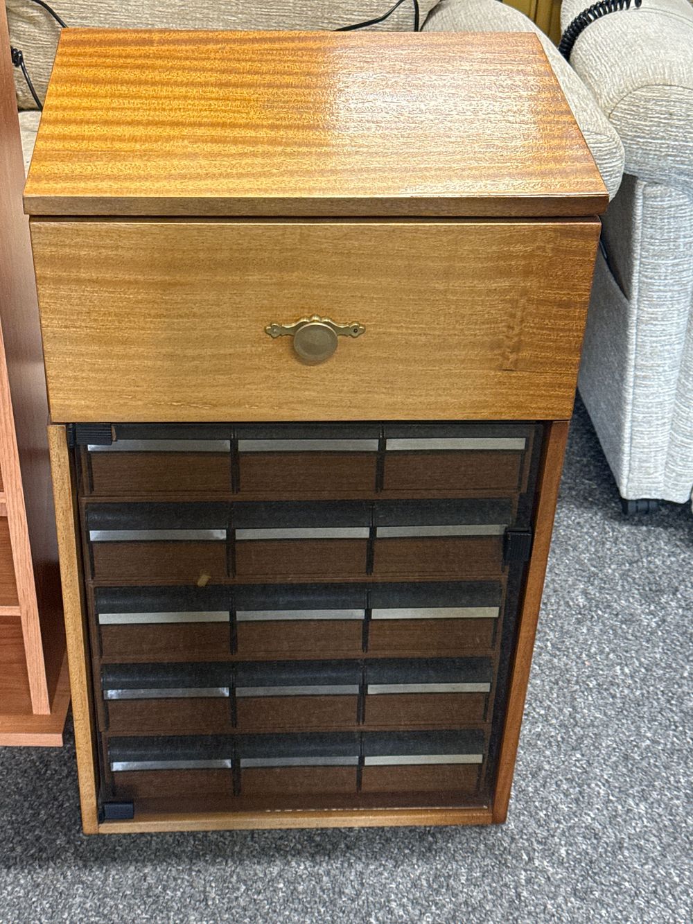 Lot 200: A mid-century modern wood veneer media and cassette storage cabinet
