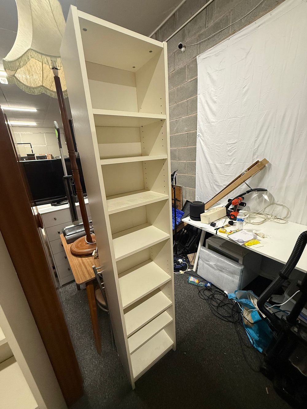 Lot 210: IKEA Tall Narrow White Laminate Bookcase