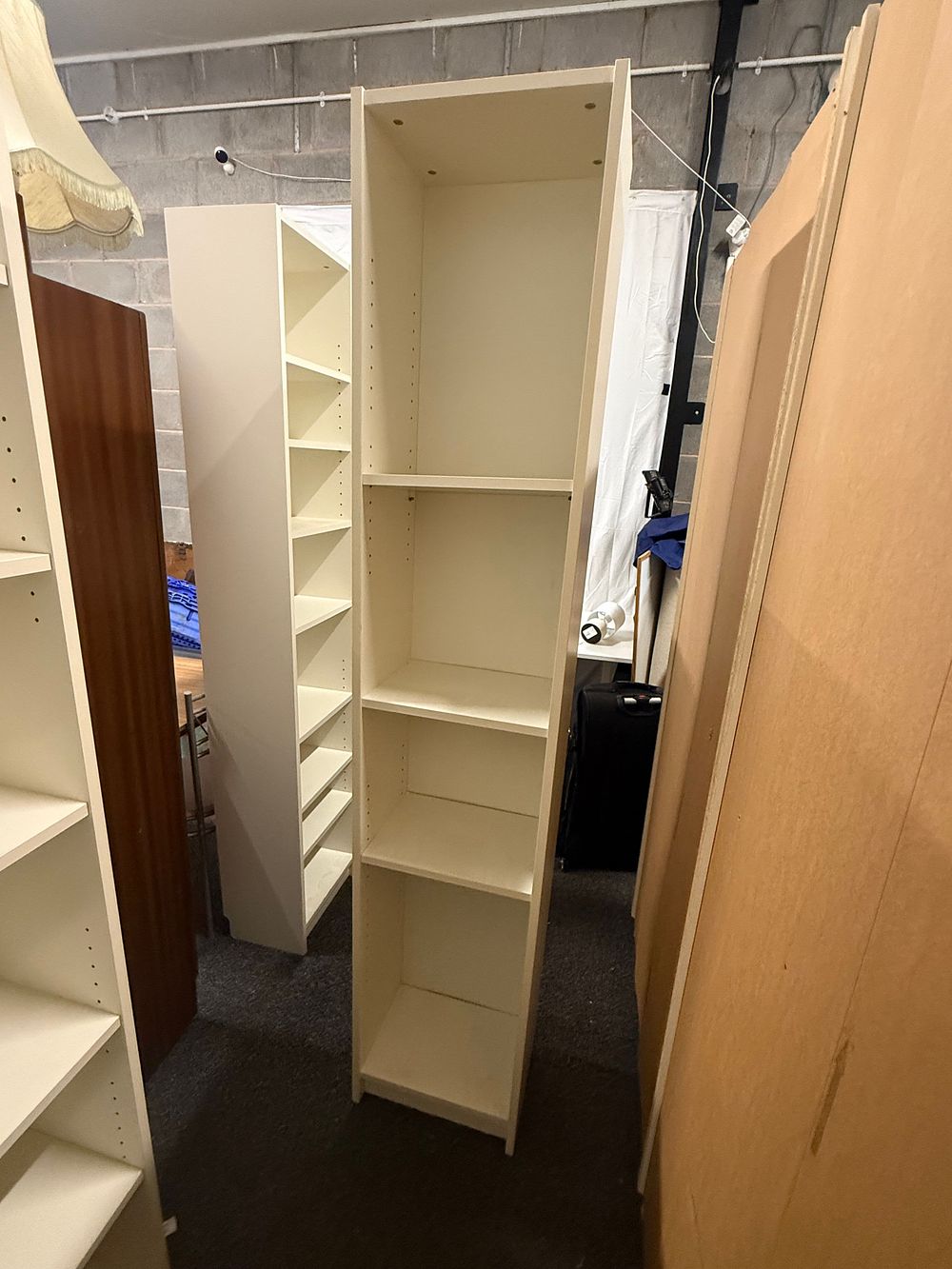 Lot 211: A contemporary white IKEA BILLY shelving unit