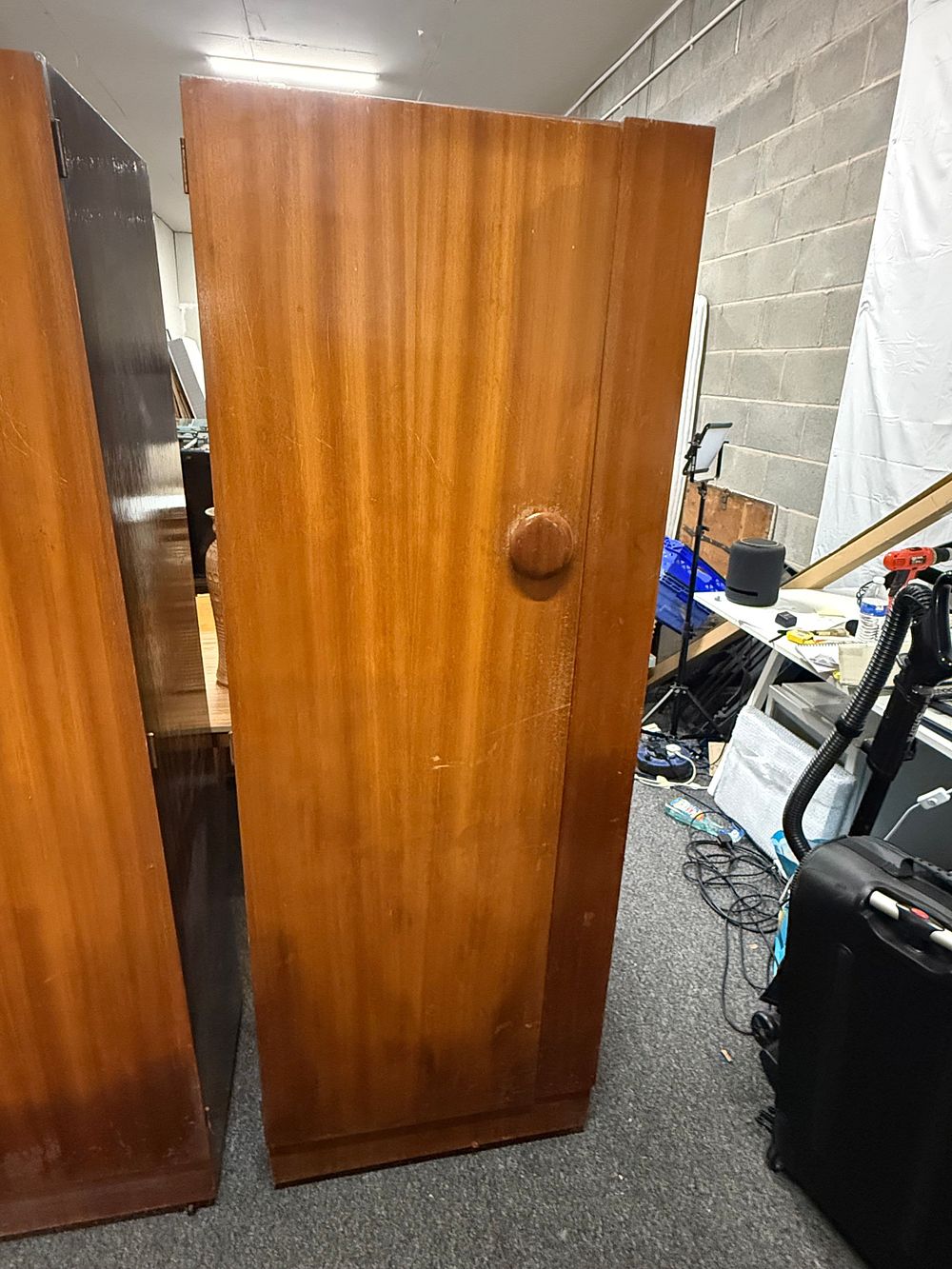 Lot 213: Mid-20th-century sapele-veneered two-door wardrobe with circular wooden handles