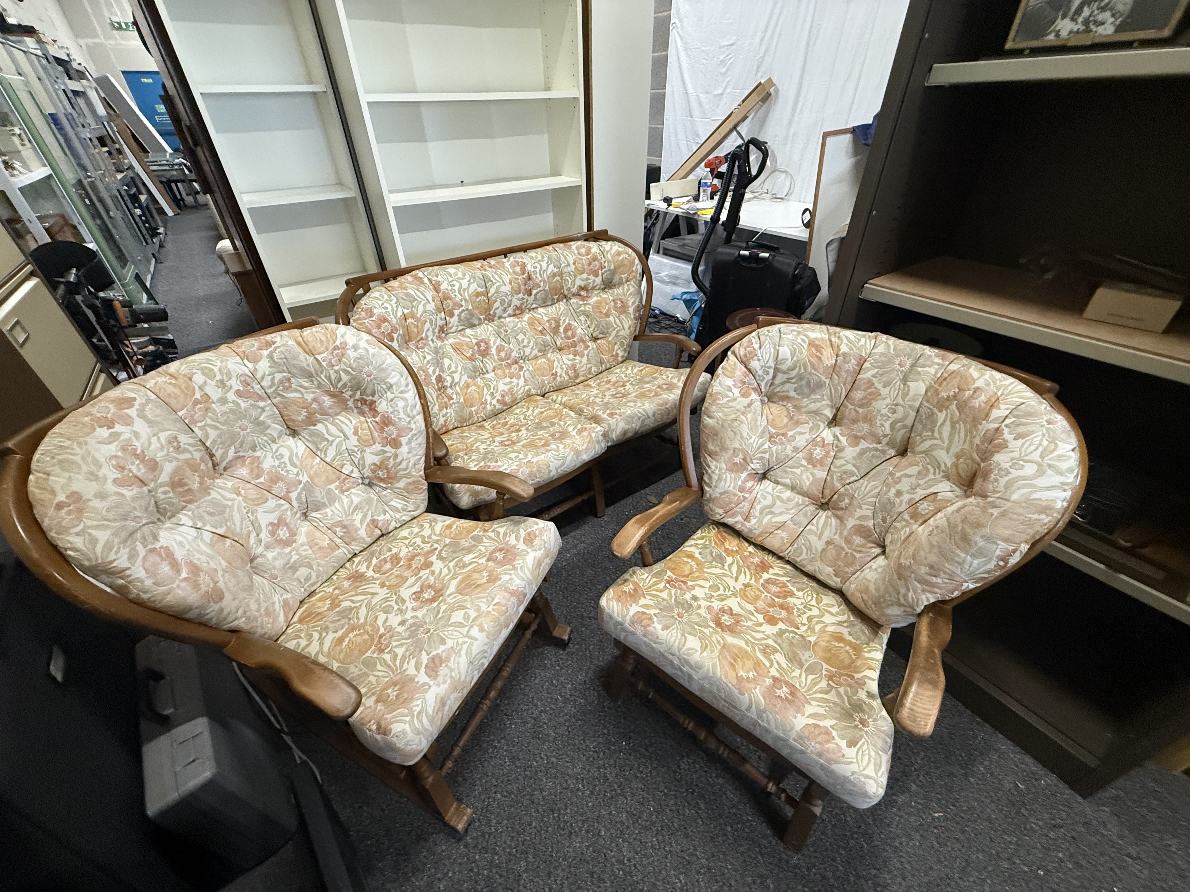 A three-piece cottage lounge suite with rocking armchairs