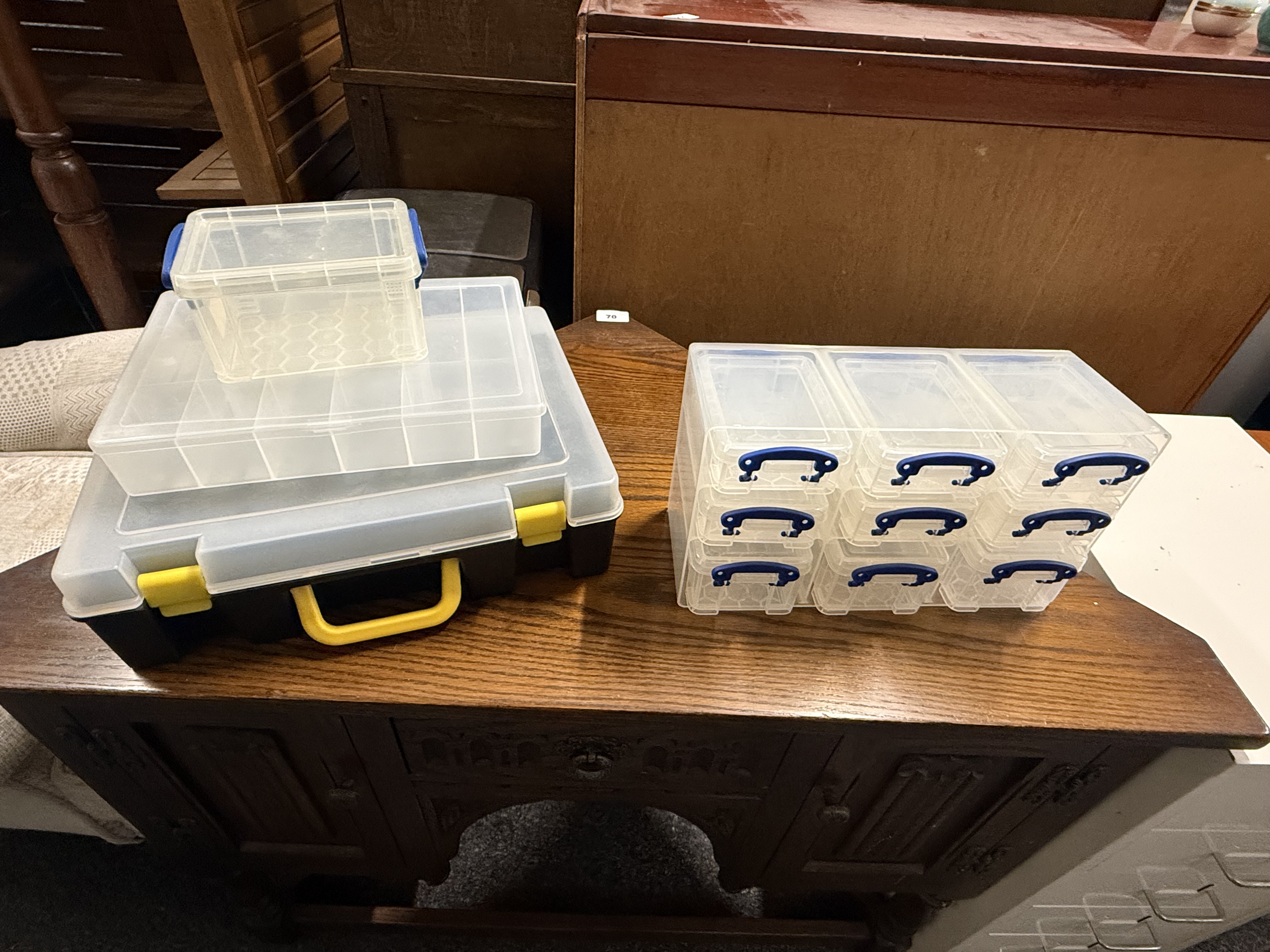A collection of assorted plastic storage containers and organiser boxes
