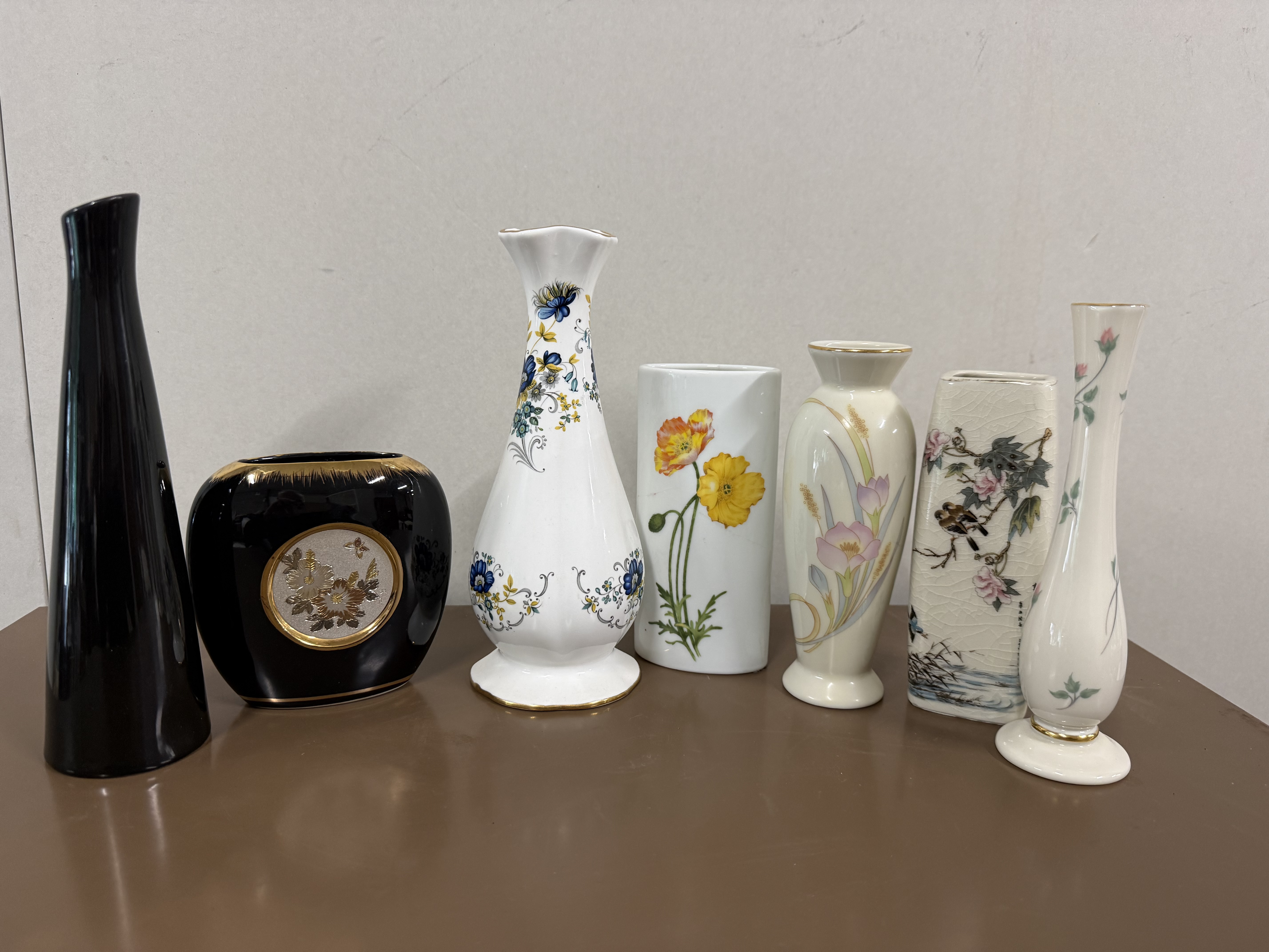 An Assortment of Seven Decorative Porcelain and Ceramic Bud Vases