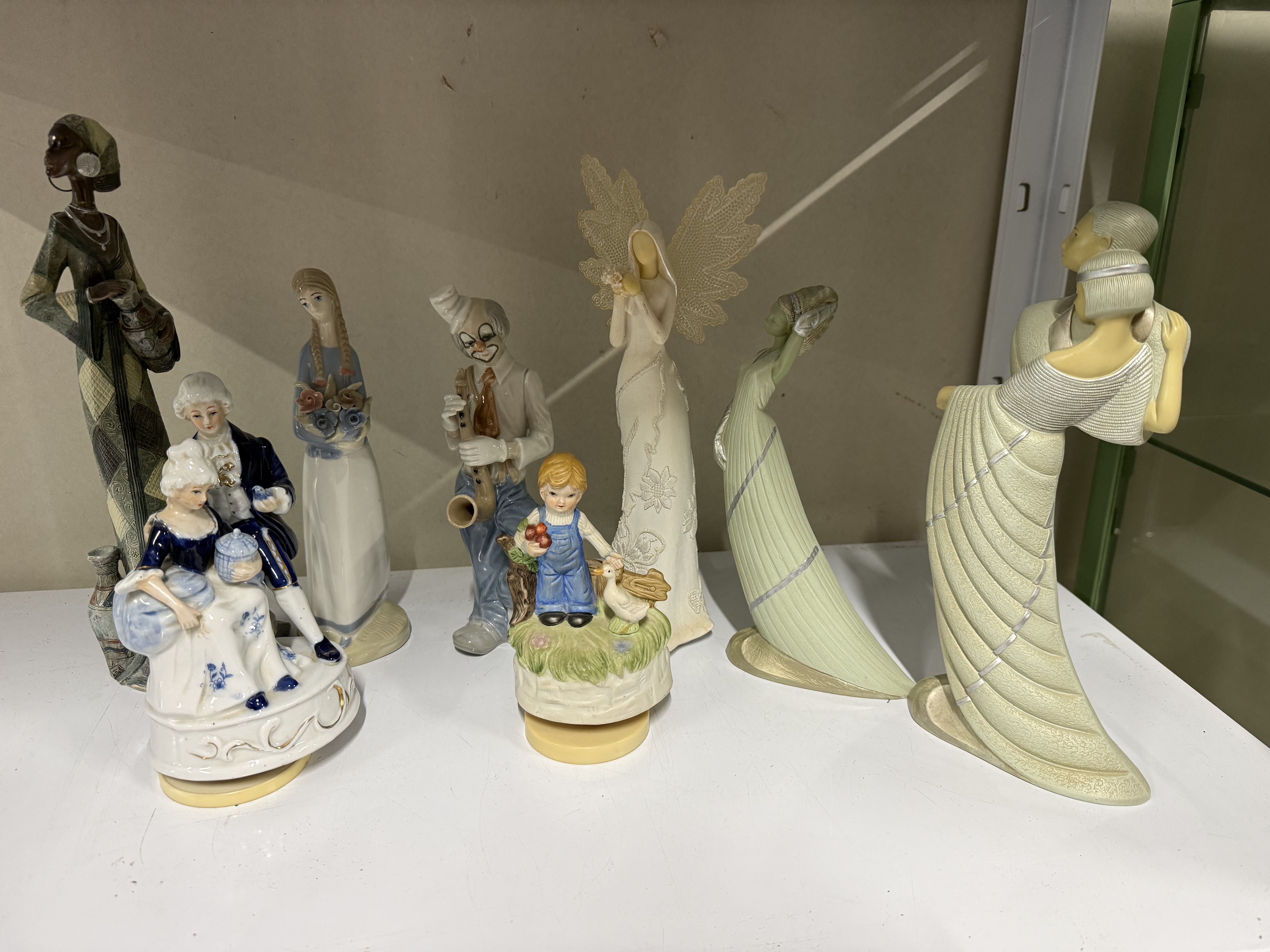 A Collection of Decorative Ceramic and Porcelain Figurines