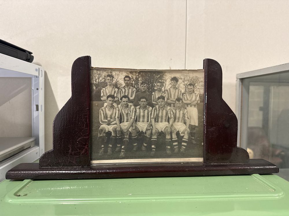 Lot 151: Vintage mid-20th century football team photograph in a wooden stand
