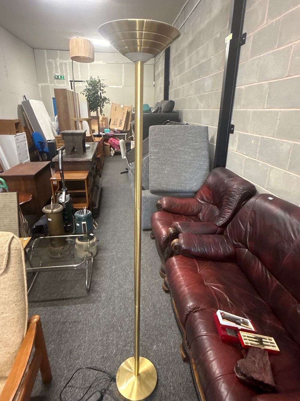 Lot 159: A vintage brass-plated modernist floor uplighter with tiered shade