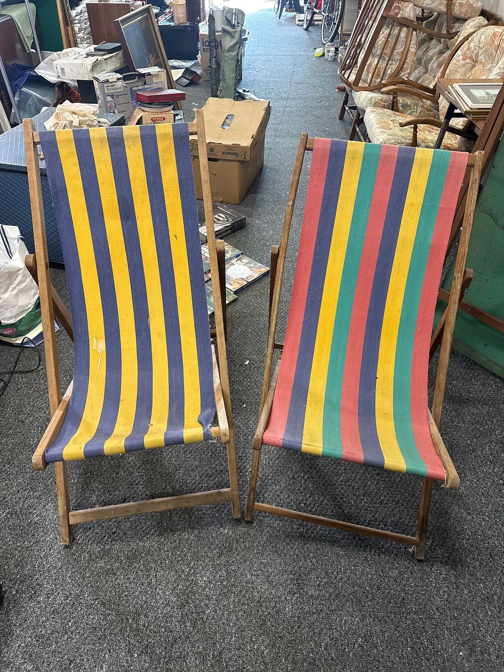 Lot 160: A pair of vintage wooden folding deckchairs with striped canvas