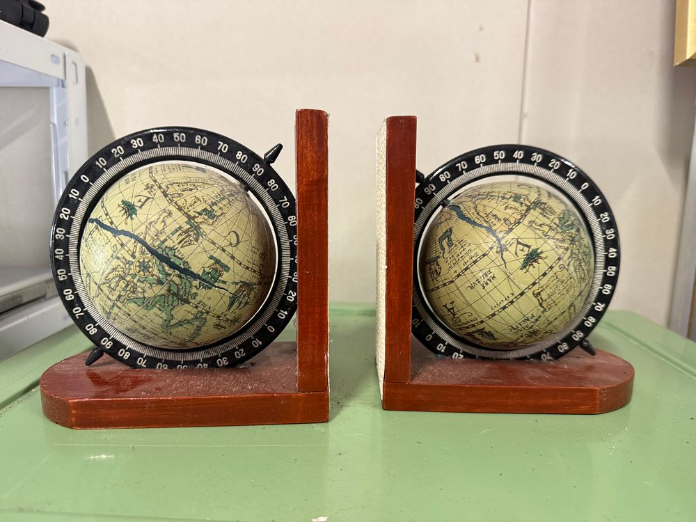 Lot 168: A Pair of Vintage Wooden Rotating Old World Globe Bookends
