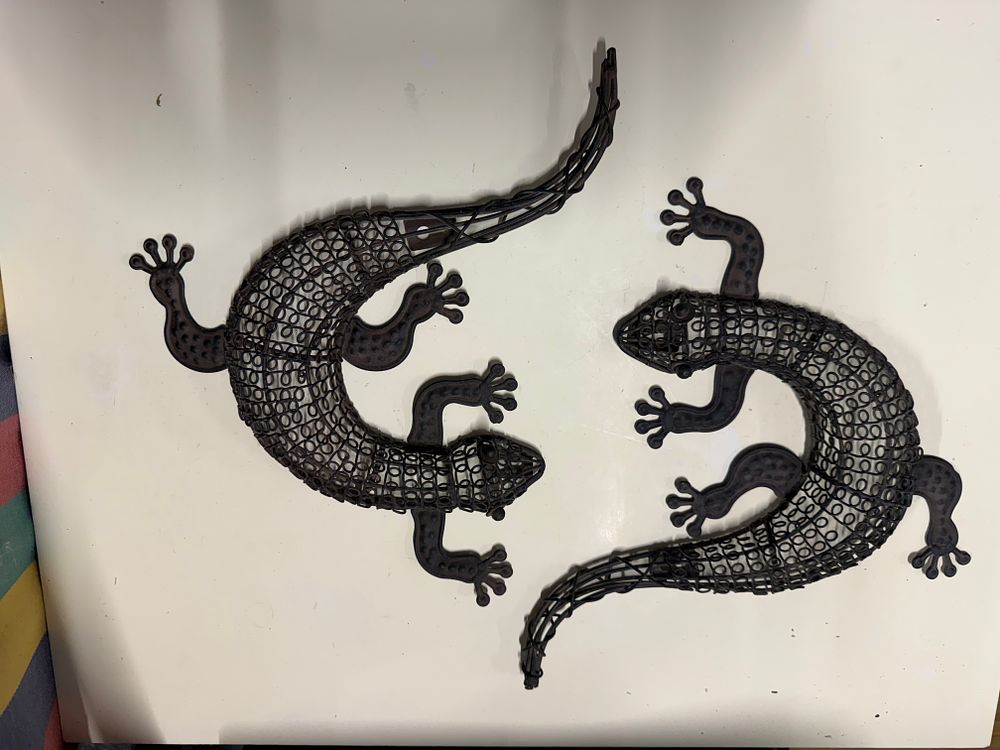 Lot 178: A Pair of Contemporary Dark Metal Wire Lizard Wall Ornaments