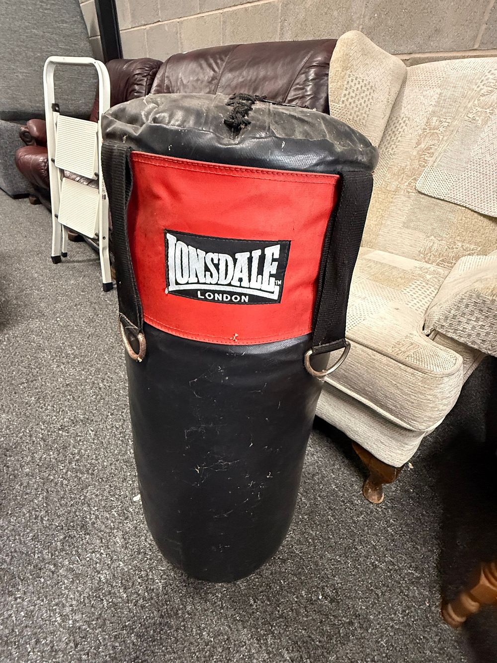 Lot 183: Lonsdale London heavy boxing punch bag in black and red