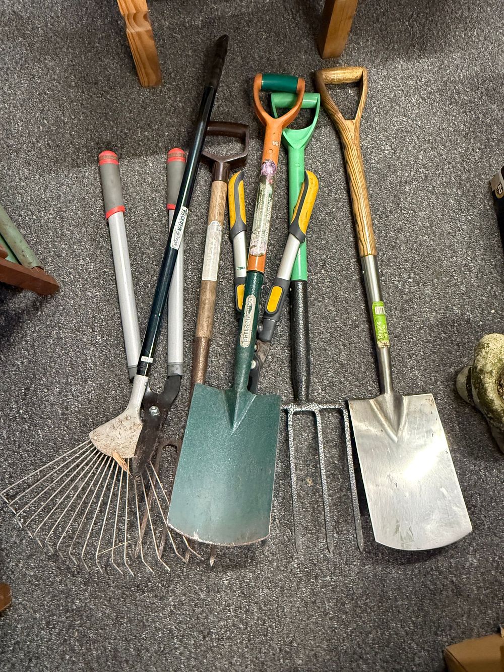 Lot 190: A collection of six garden tools including Griffin loppers