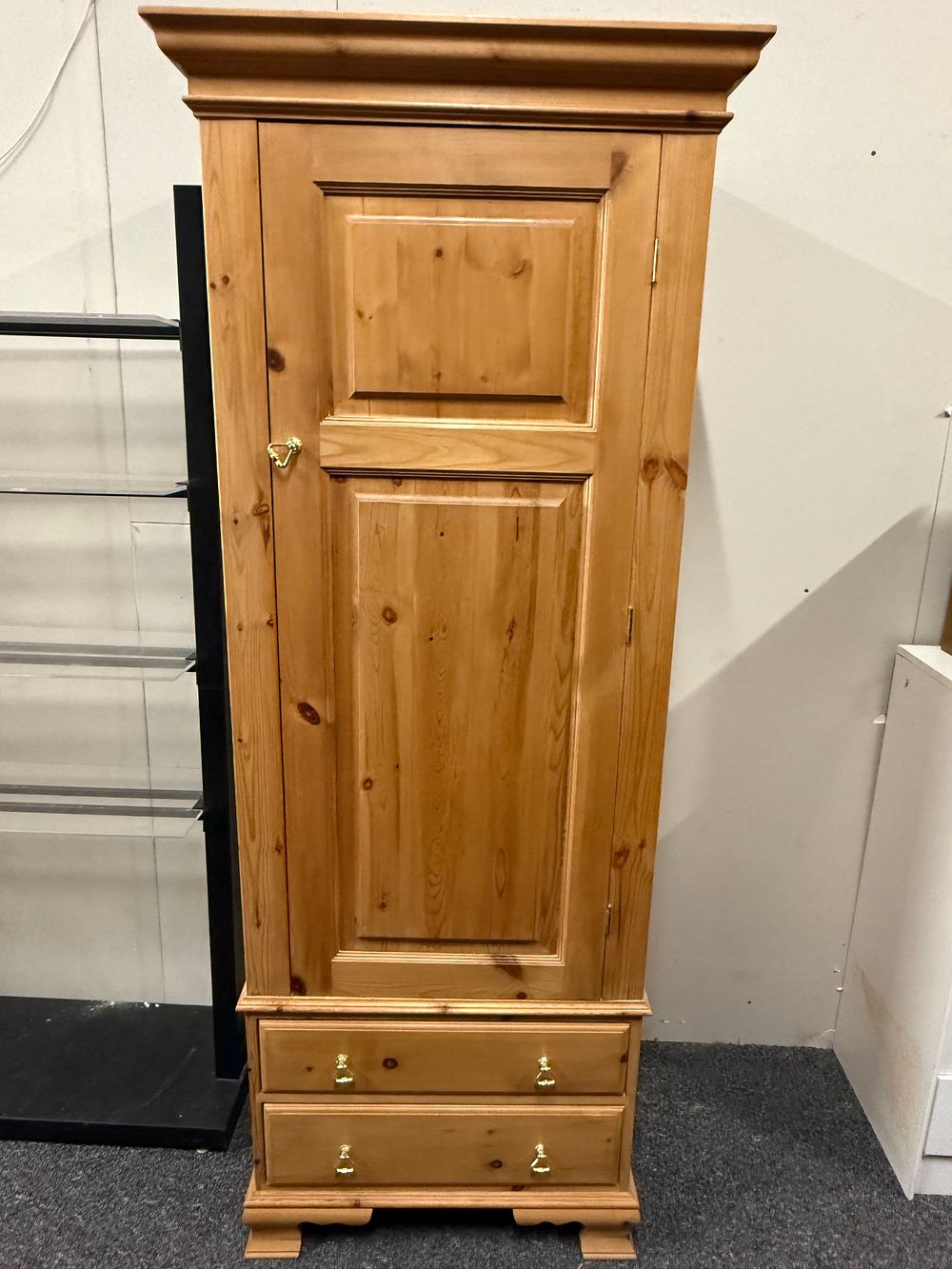 Lot 193: Traditional tall solid pine single door wardrobe with two drawers
