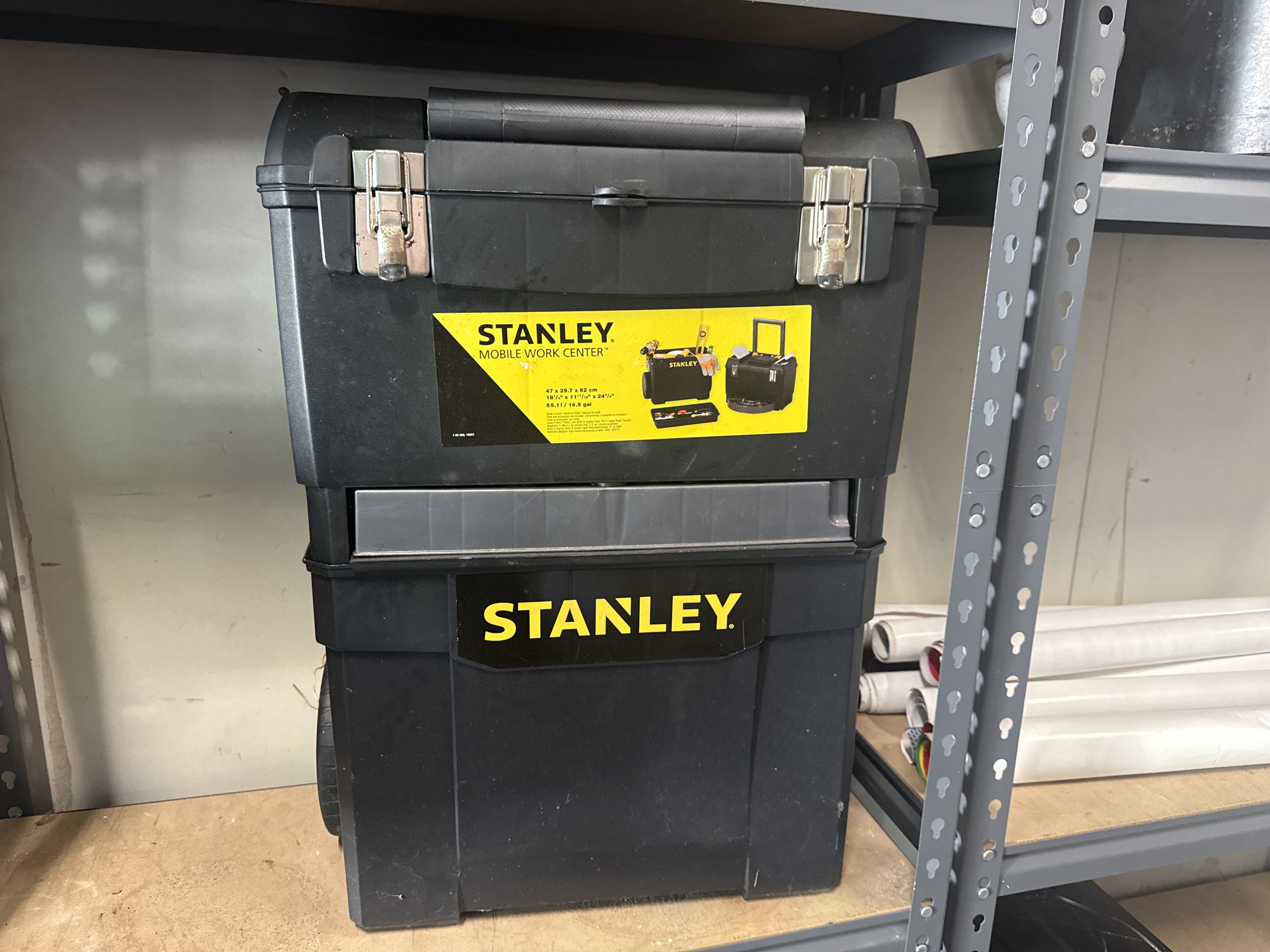A Stanley mobile work centre rolling plastic tool box