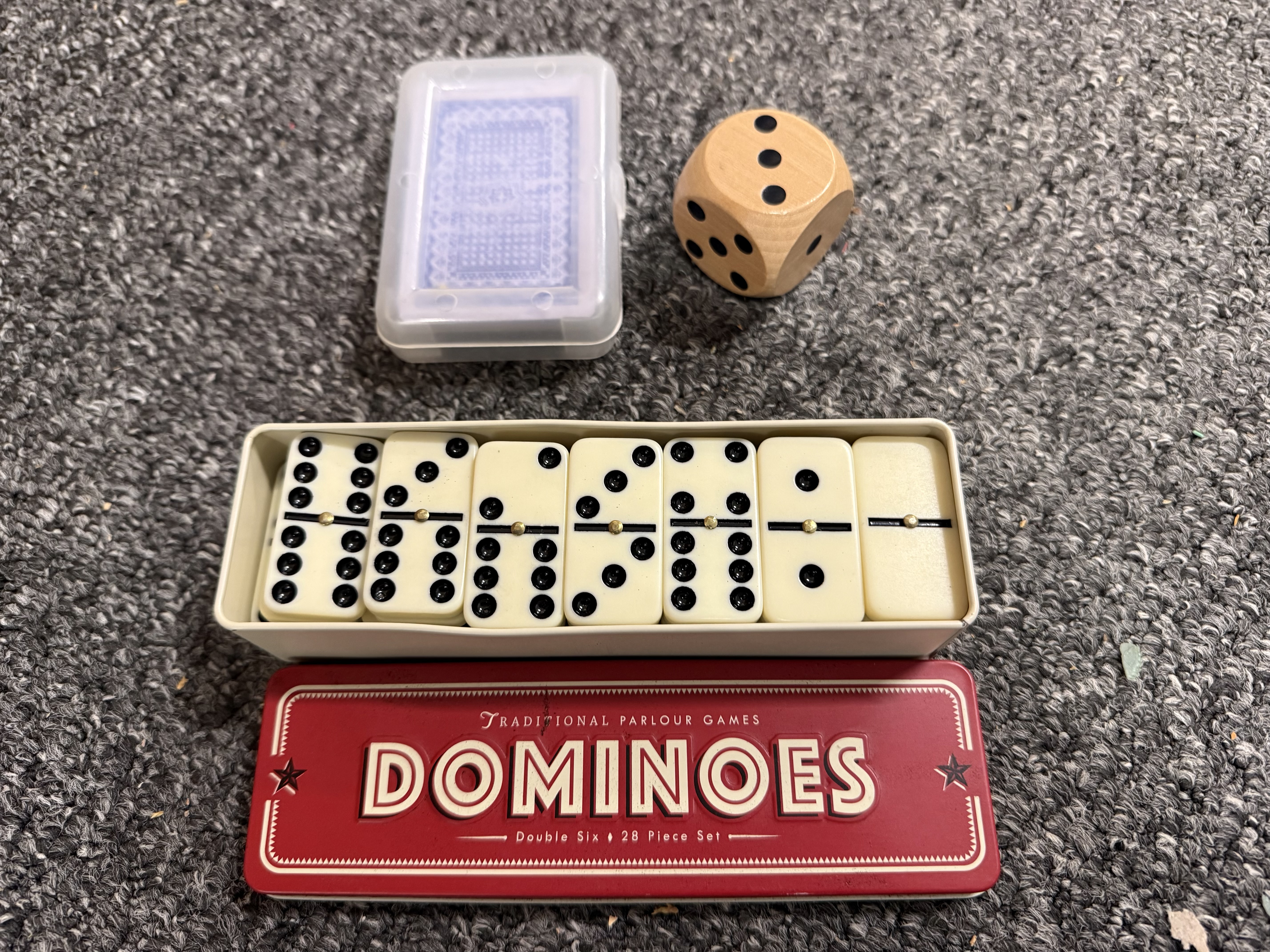 Three traditional parlour games including a cased domino set