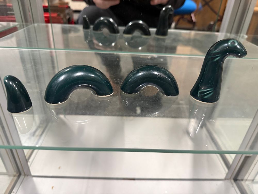 Lot 13: A four-piece ceramic Loch Ness Monster novelty sculpture