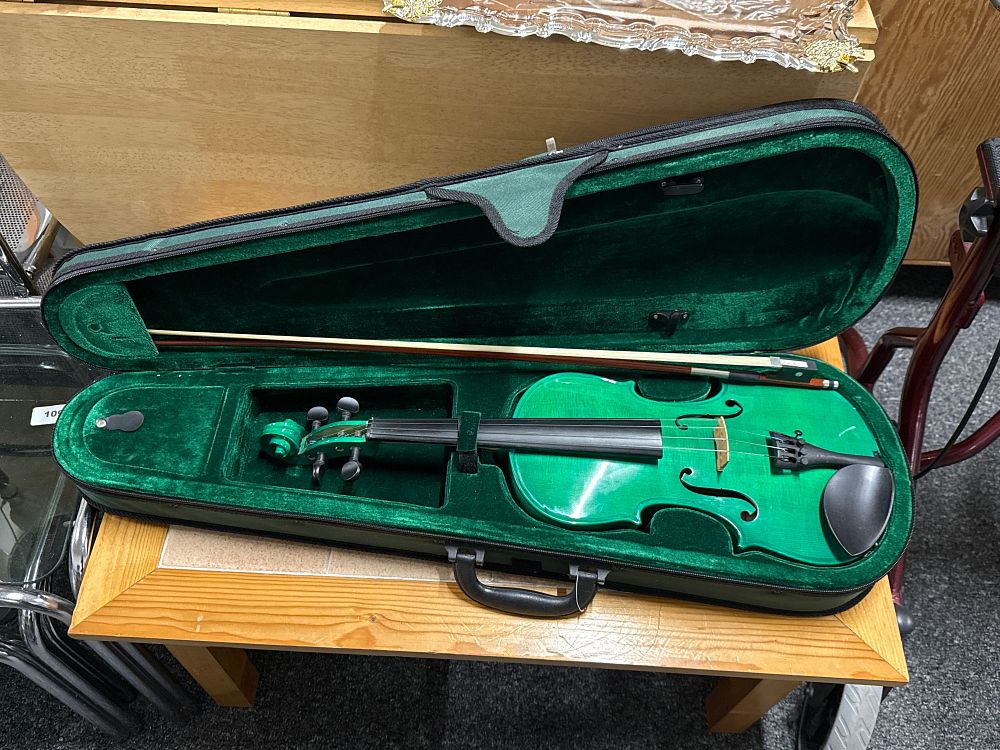 Lot 18: A vibrant emerald green Viva Music student violin outfit