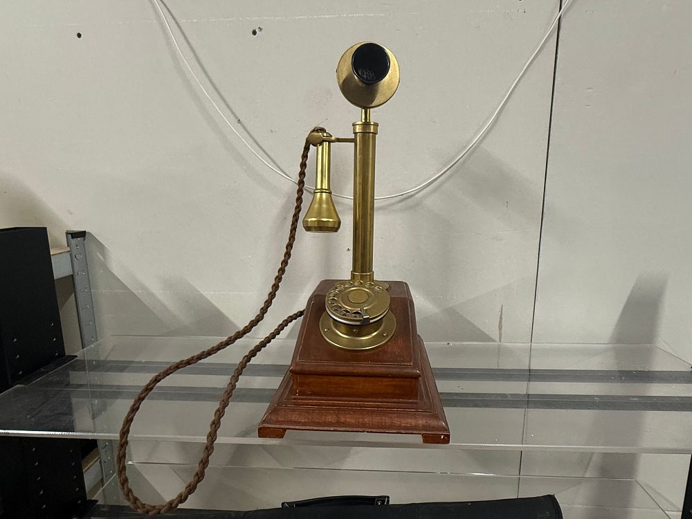Lot 30: A vintage style wall mounted wooden and brass rotary telephone