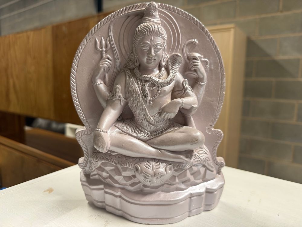 Lot 4: A contemporary pearlescent cast composite relief plaque of Lord Shiva