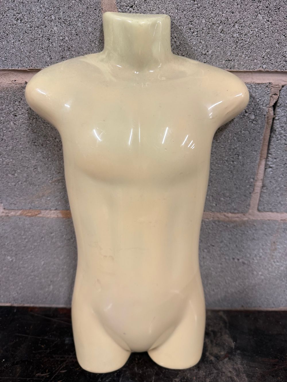 Lot 53: A Contemporary Pale Yellow Glossy Plastic child Mannequin Torso