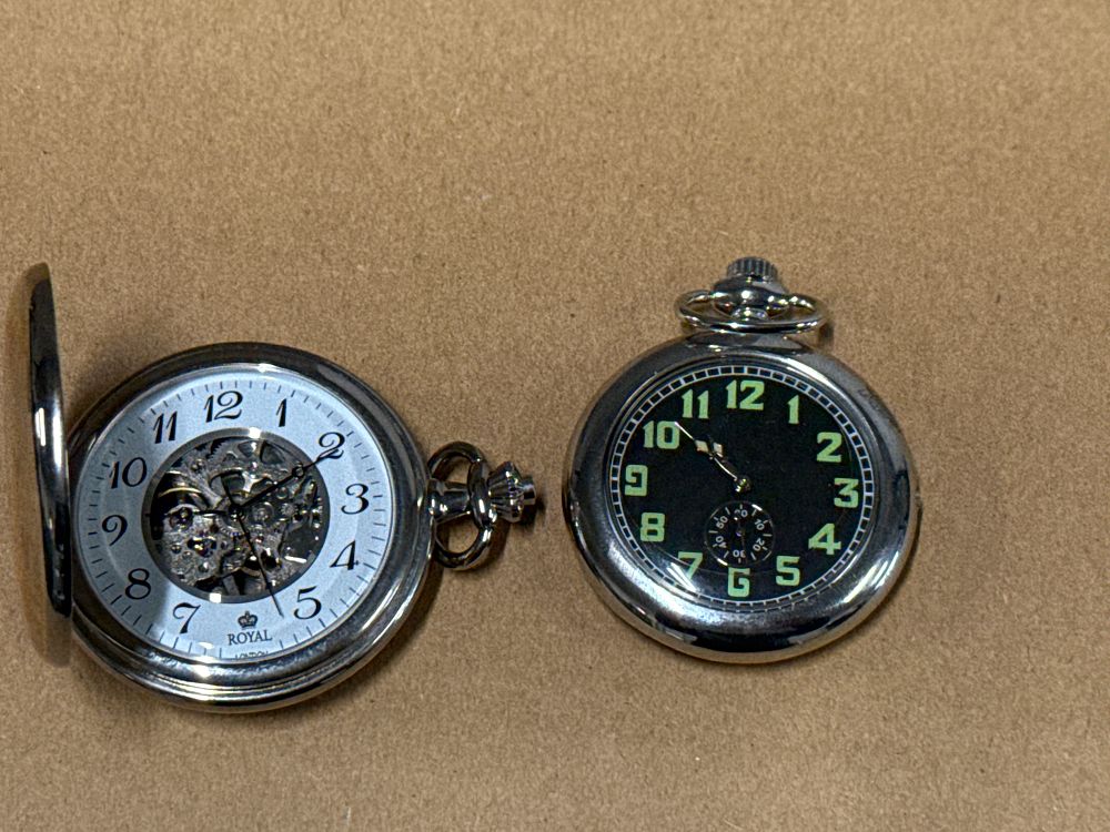Lot 108: Two silver-tone pocket watches including a Royal London skeleton hunter