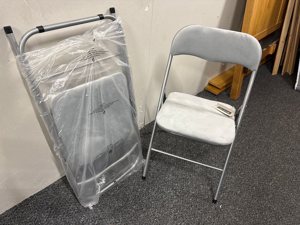 Lot 145: A pair of Living Solutions grey velvet folding side chairs
