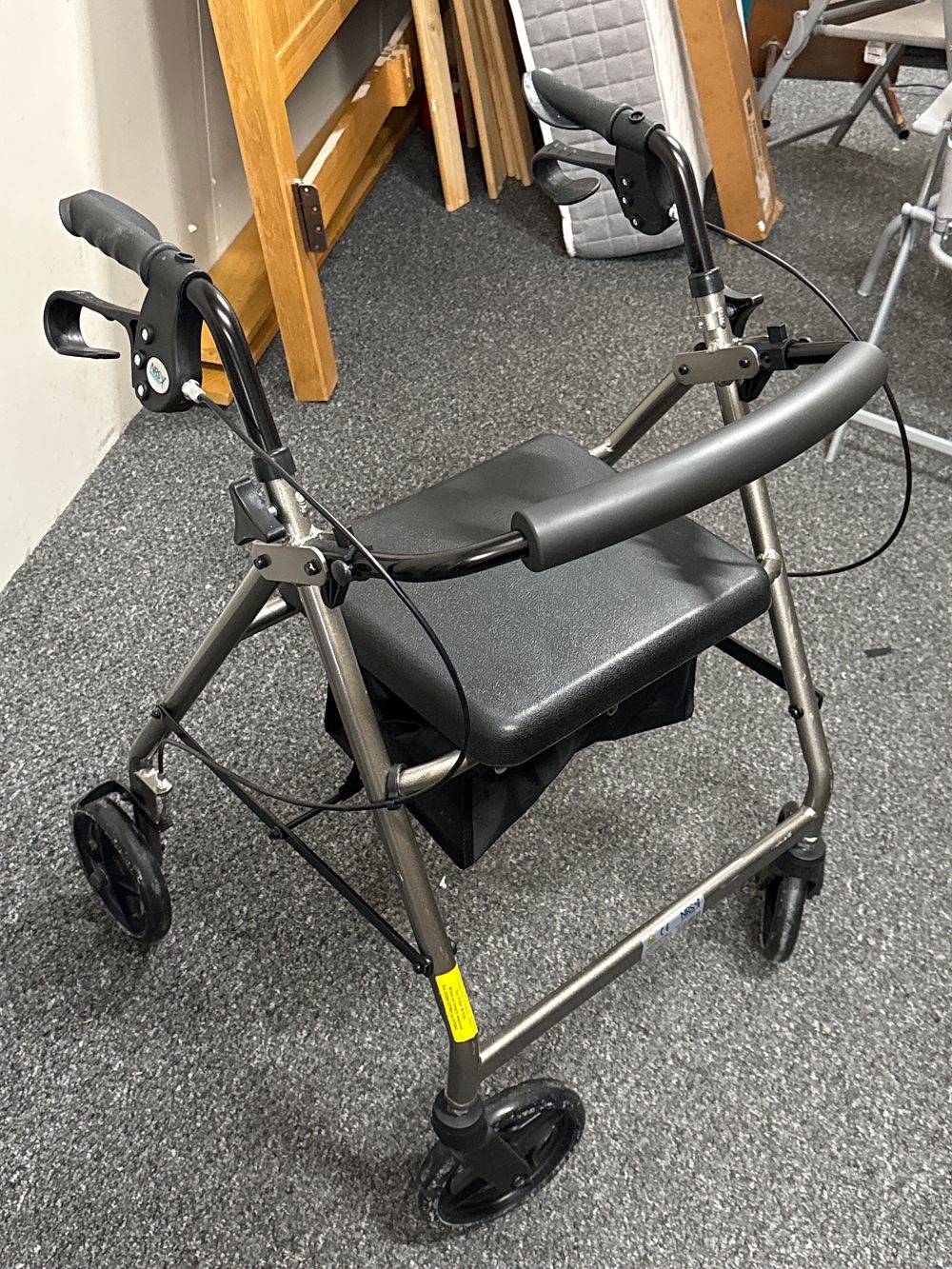 Lot 140: NRS Healthcare four-wheeled folding rollator with padded seat