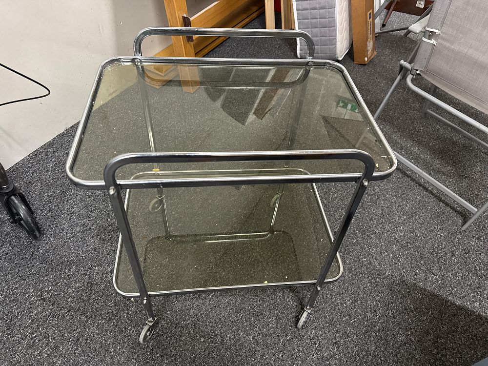 Lot 146: A Mid-Century Modern chrome and smoked glass two-tier drinks trolley