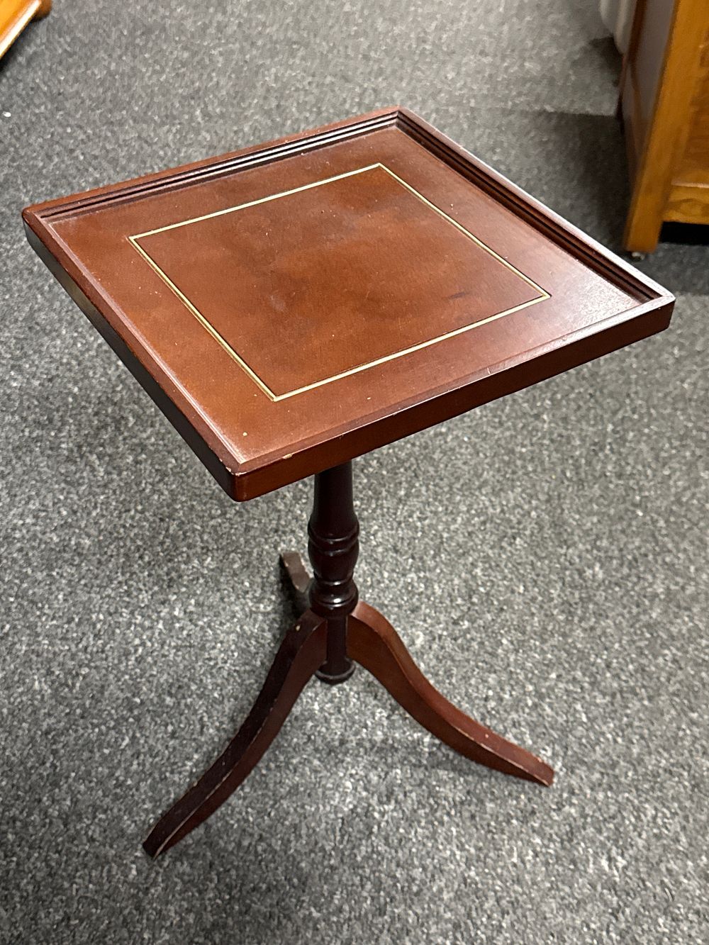 Lot 71: A Regency style mahogany-stained tripod wine table with stringing