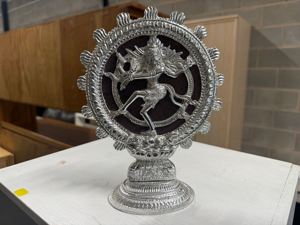 Lot 5: A polished white metal figure of Shiva Nataraja