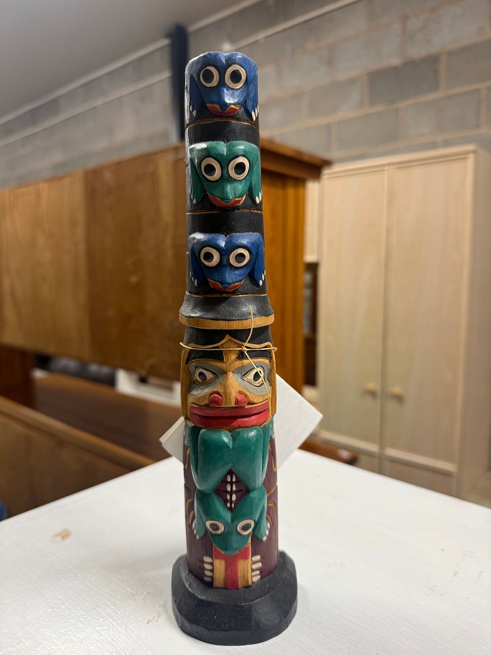 Lot 6: A carved and painted Northwest Coast style wooden totem pole