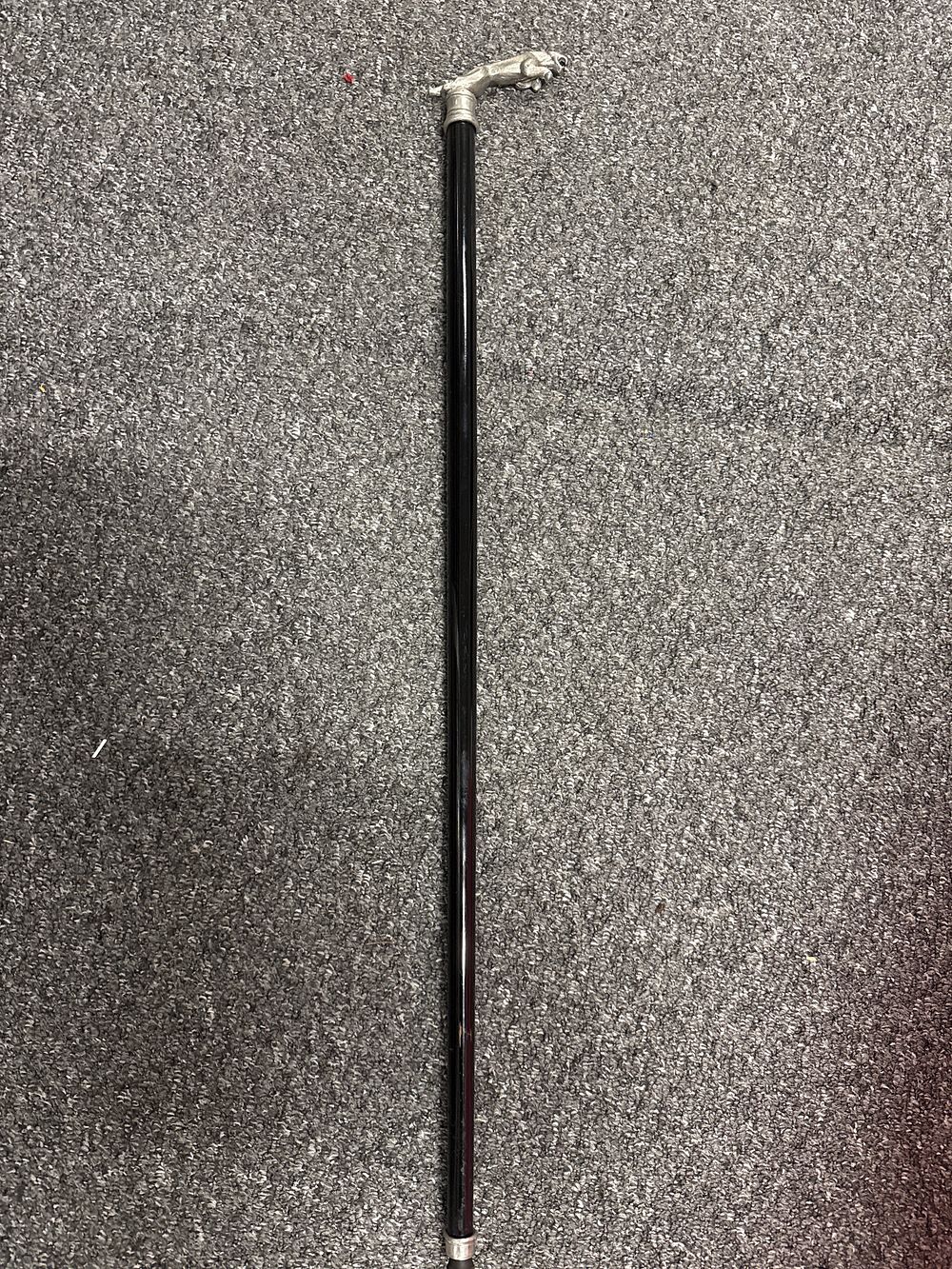 Lot 138: A contemporary walking cane with a silvered leaping jaguar handle