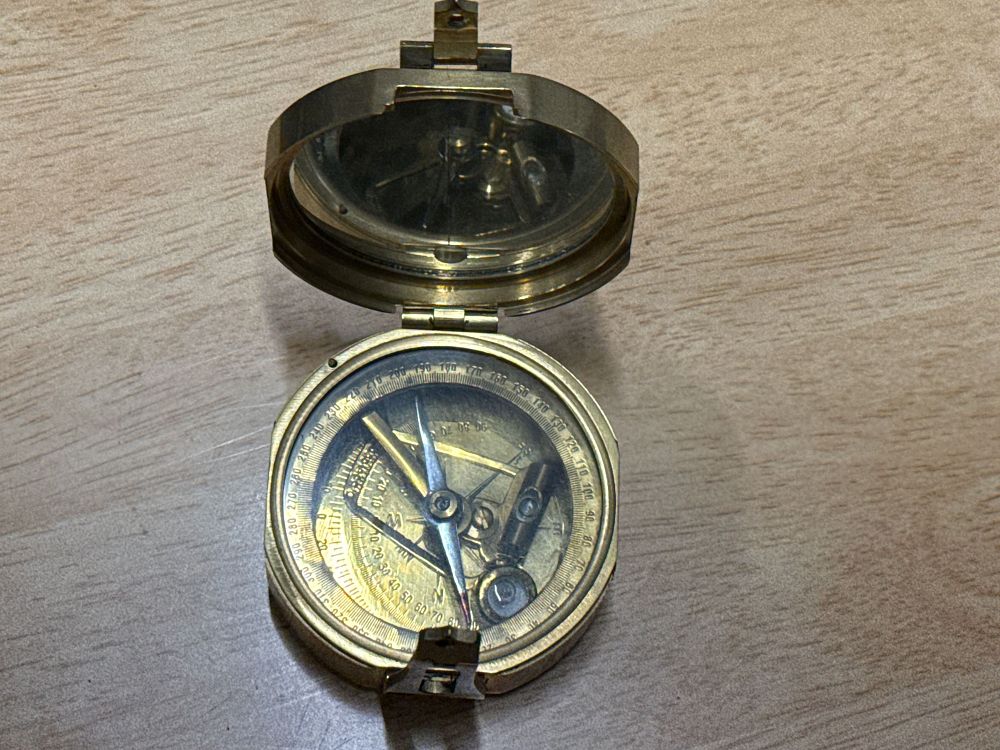 Lot 106: Vintage brass pocket transit compass with natural sine table