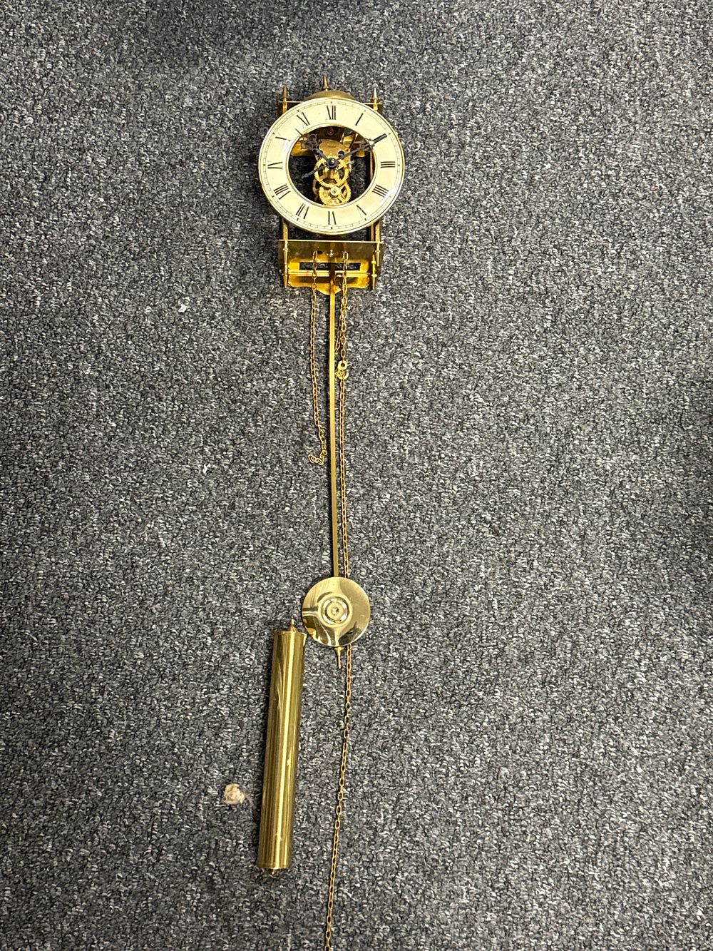 Lot 114: German brass Whitehall skeleton wall clock movement and parts