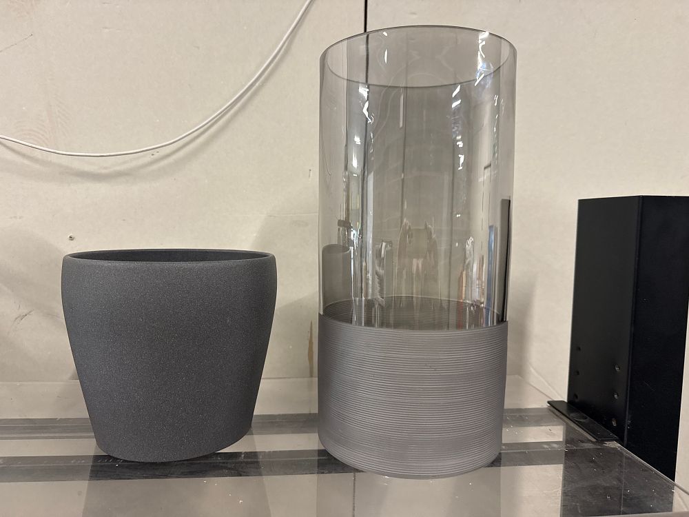 Lot 127: Charcoal grey textured planter and a smoked glass hurricane vase