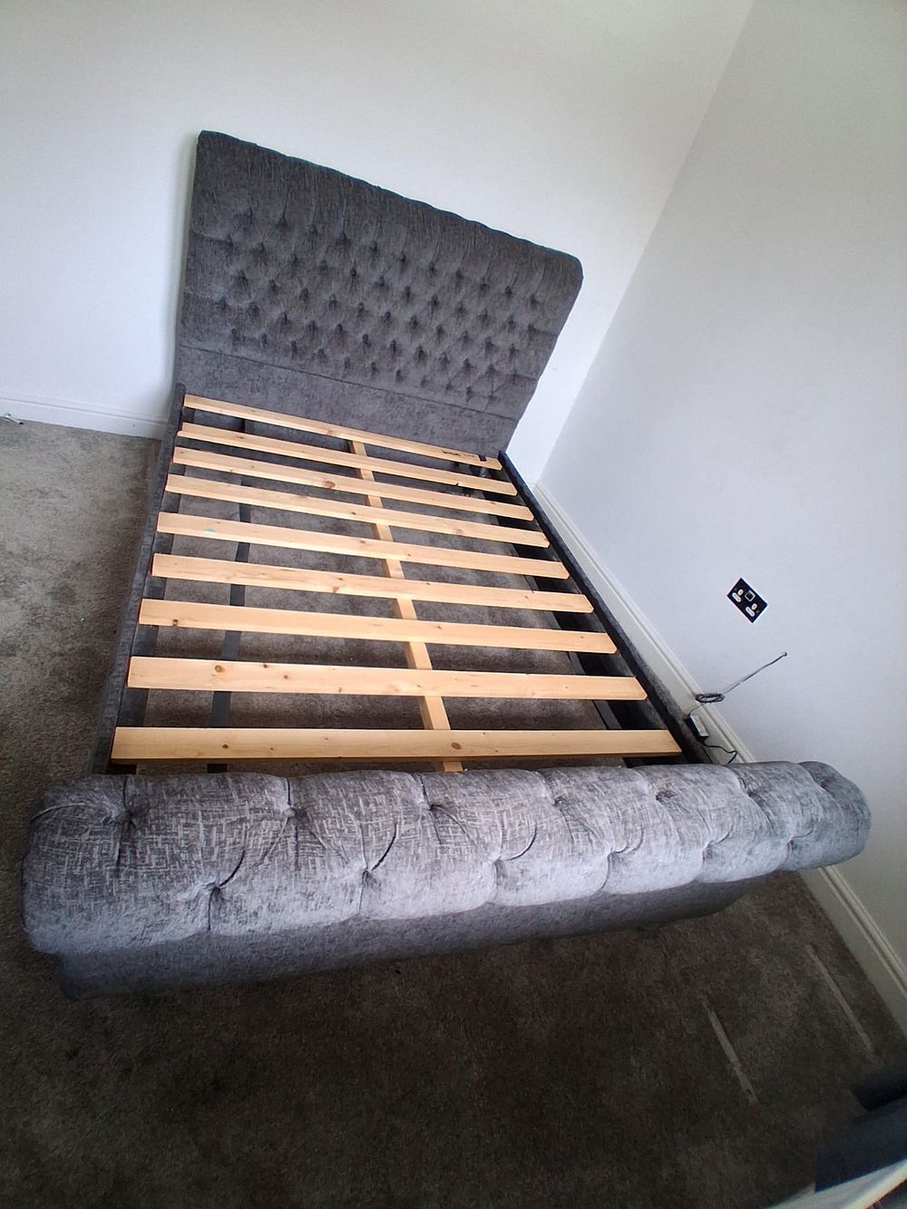 Lot 147: Contemporary grey upholstered Chesterfield style sleigh bed frame