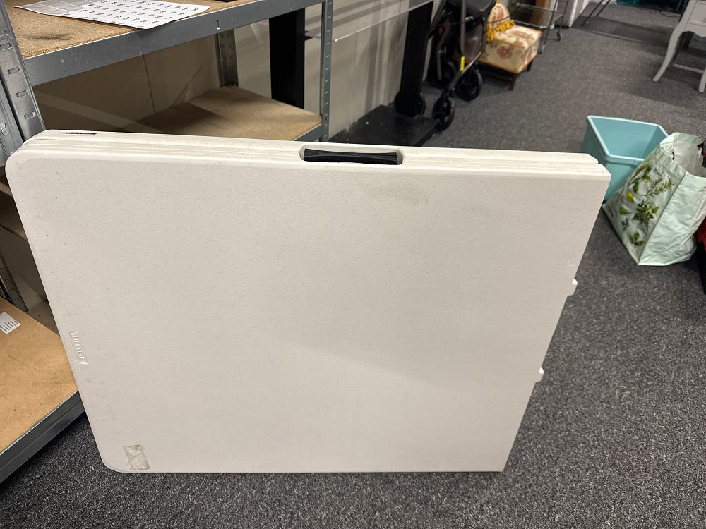 Lot 151: A Lifetime portable fold-in-half utility table with steel frame