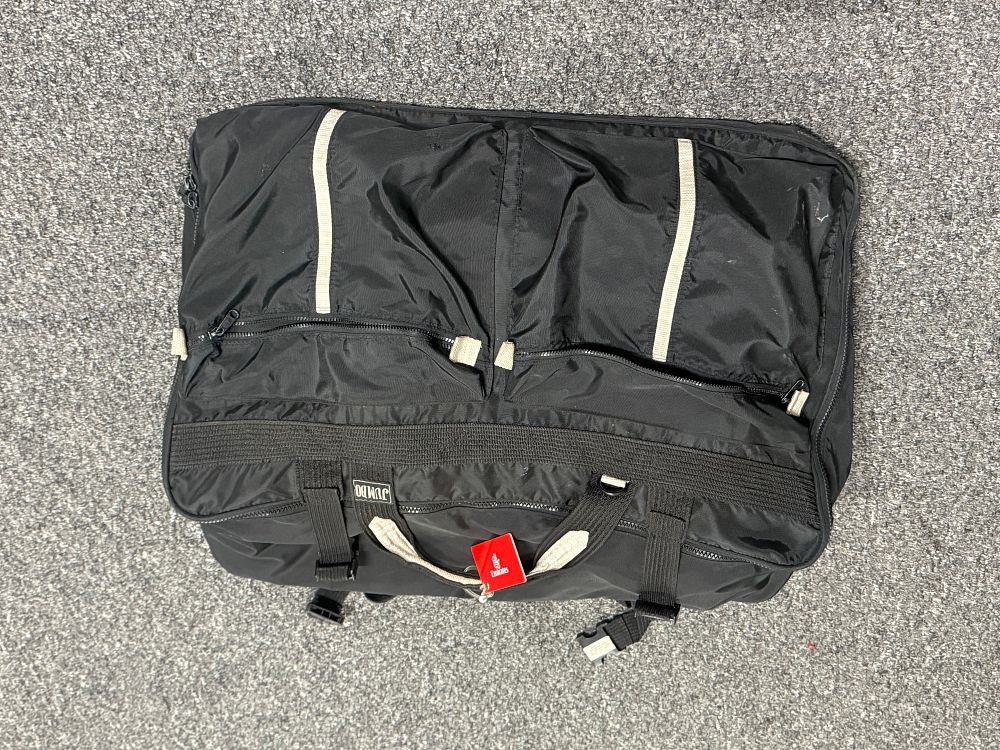 Lot 165: A Jumbo black textile multi-compartment travel bag full of more holdalls