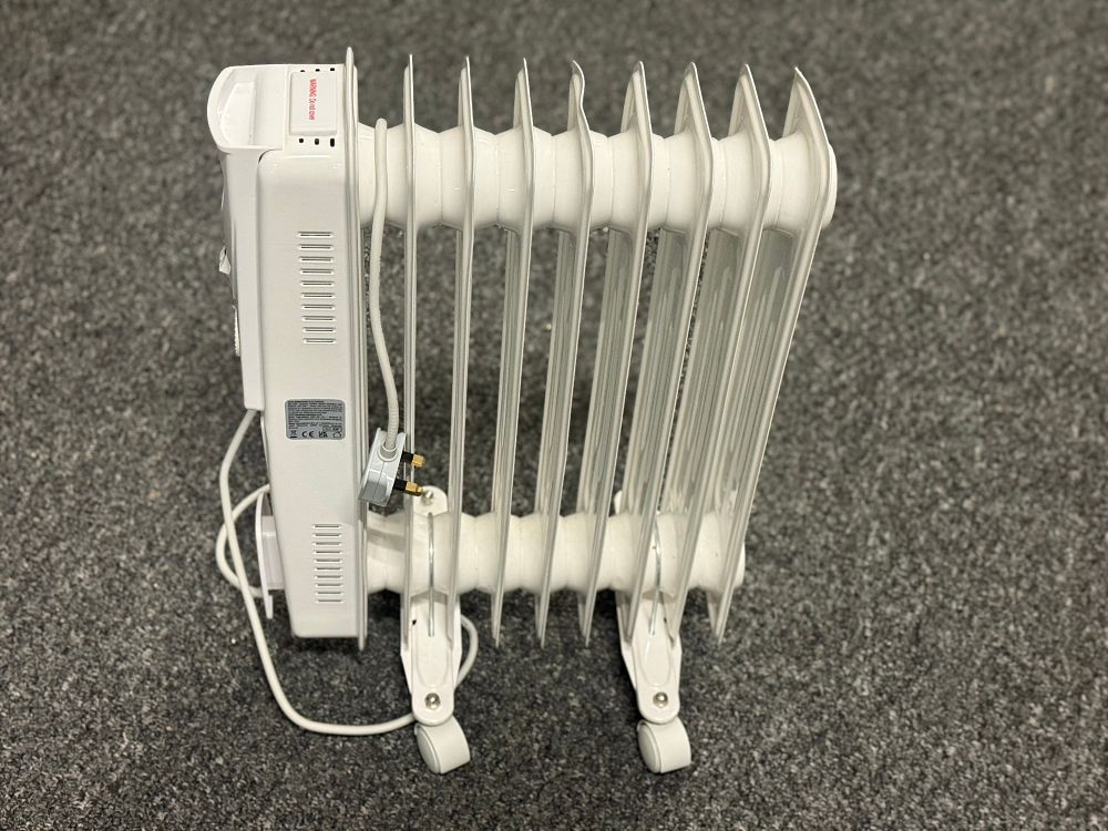 Lot 168: Status white seven fin oil filled portable radiator heater