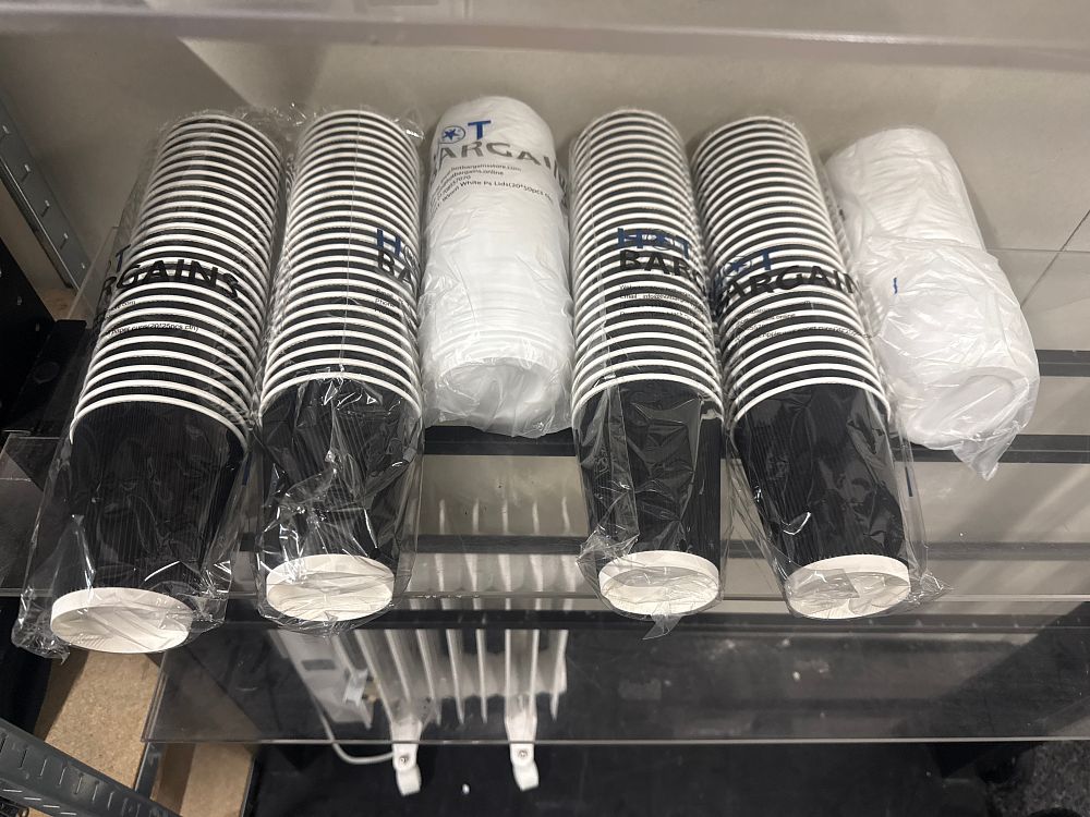 Lot 167: A group of Hot Bargains black ripple coffee cups and lids
