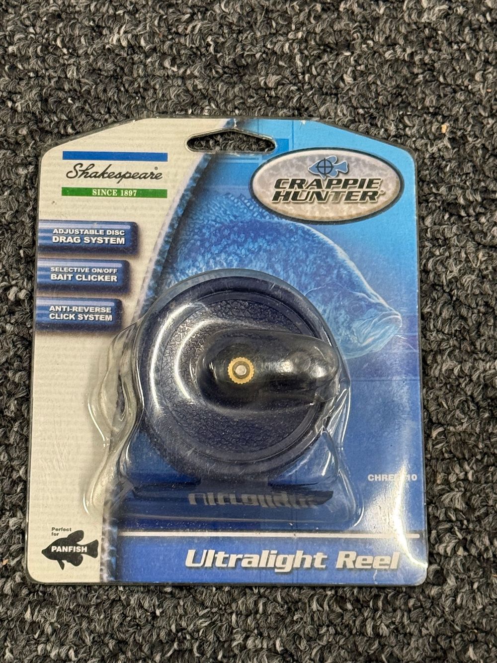 Lot 200: A Shakespeare Crappie Hunter ultralight fishing reel, model CHRE10. Despite its name , it is not for fishing down the toilet .