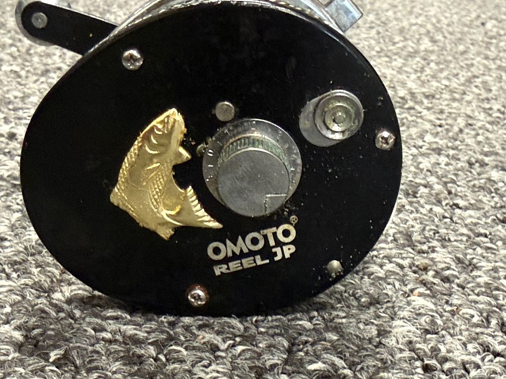 Lot 205: An Omoto Hubilie 777S3 Baitcasting Fishing Reel with Power Handle
