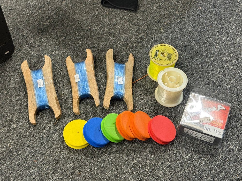 Lot 206: A collection of fishing lines, wooden reels and rig winders